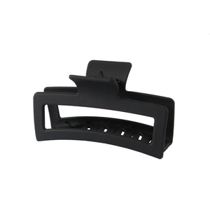 Matte black 13cm rectangular hair claw clip with hollow design on white background