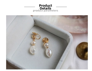 Close-up of baroque freshwater pearl earrings with adjustable gold screw-on clips