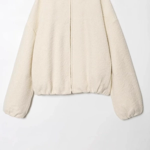 Minimalist cream white sherpa fleece jacket with high collar and elastic ribbed hem