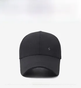 Front view of black baseball cap with extended brim and fashion embroidery detail