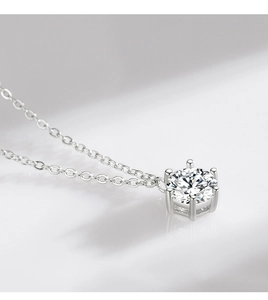 Macro shot of 925 sterling silver necklace with a six-prong round-cut diamond pendant