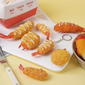 Realistic fried tempura shrimp keychain featuring golden breadcrumb texture on a white plate