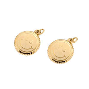Detailed view of two gold round smiley face charms with polished metal finish