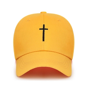 Minimalist bright yellow cotton baseball cap with black cross embroidery in a classic design