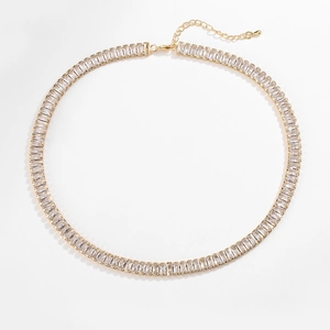 Detail of gold necklace with rectangular zircons showing extension chain and droplet charm