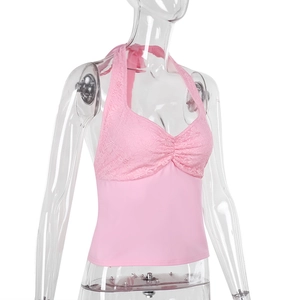 Close-up of pink halter top featuring intricate lace patterns and premium solid fabric
