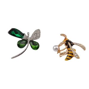 Elegant dragonfly and honey bee insect brooches with crystals and pearls on white background