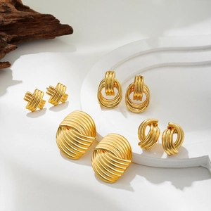 Set of four 14k gold-plated geometric textured stud earrings with twisted metal patterns