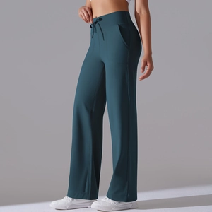 Detail view of high-waist yoga wide-leg pants with adjustable drawstring and side pockets