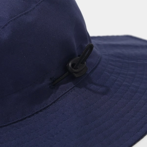 Detail of navy sun hat with adjustable drawstring buckle and reinforced stitching