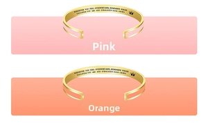 Detail of gold-plated bracelets featuring colorful enamel and MOTHER DAUGHTER engraving