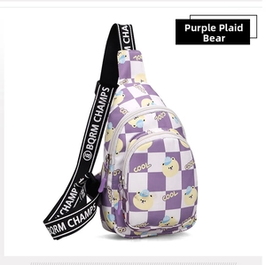 Detail of purple plaid chest bag featuring a cartoon bear and adjustable woven strap