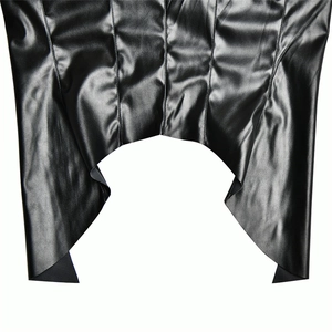 Detail of black faux leather halter top showing glossy texture and irregular curved hem