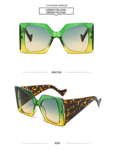 Details einer quadratischen Übergroßen Sonnenbrille mit grün-gelbem Farbverlauf und Bügeln