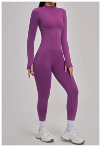 Detail view of purple yoga jacket featuring thumbhole cuffs and a stand-up collar