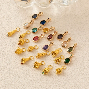 Assorted birthstone flower charms with vibrant zircon stones in gold and silver plating