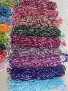 Close-up of assorted colorful round glass beads for DIY jewelry and crafts making