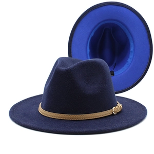 Detail of wool fedora hat with blue contrast lining and thin leather band with gold buckle
