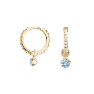 Detail of S925 silver gold hoop earring with pavé diamonds and a light blue stone pendant