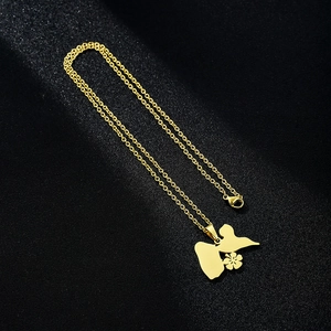 Close-up of golden stainless steel butterfly and flower pendant on fine chain