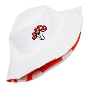 Detail of red and white mushroom embroidery on white cotton bucket hat with dotted lining