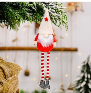 Close-up of a hanging Christmas gnome with long striped legs and a white star hat
