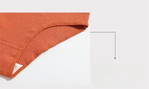 Detail of orange ribbed cotton panties showing elasticated edging and breathable soft fabric