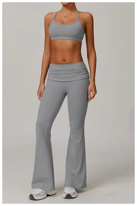 Detailed front view of gray yoga set showing waist ruching and flared leg detail