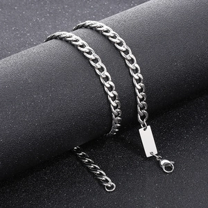 Close-up of 7mm silver Cuban chain necklace with blank engravable rectangular tag