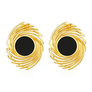 Close-up of 18K gold plated stainless steel earrings with black spiral fireworks design