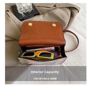 Detail view of colorful laser leather crossbody bag interior showing main capacity