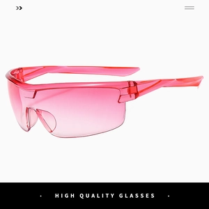 Close-up of pink translucent sports sunglasses with streamlined frame for outdoor cycling