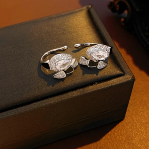 Macro shot of luxury cat-shaped ring with black enamel and zircon on leather box