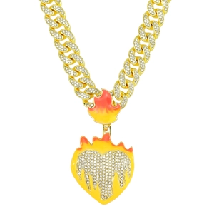 Detail of gold Cuban chain necklace with iced-out heart and orange flame pendant