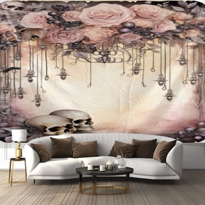 Detail of gothic dark romantic wall tapestry featuring skulls and pink roses in a living room