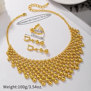 Exaggerated gold beaded necklace set with matching tassel earrings and ring for women