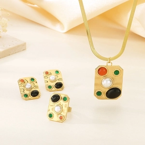 Vintage palace style jewelry set with gold hammered texture and multi-color gemstones