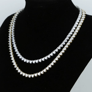 Detailed close-up of 5mm heart-shaped zircon tennis chains in gold and silver plating