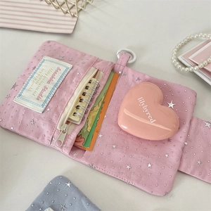 Detailed view of pink star pattern card wallet with zipper pocket and card slots