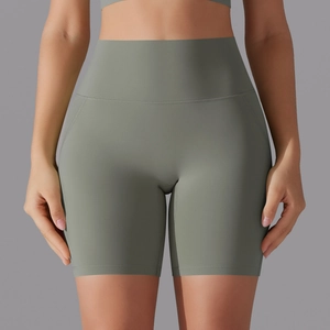 Front view of high waisted yoga shorts showing seamless compression and grey-green fabric