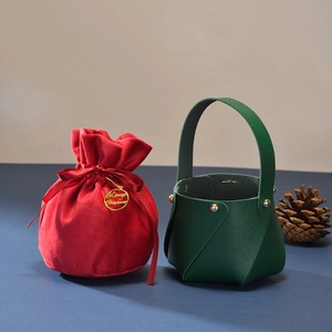 Festive red velvet drawstring pouch and green faux leather gift basket for Christmas