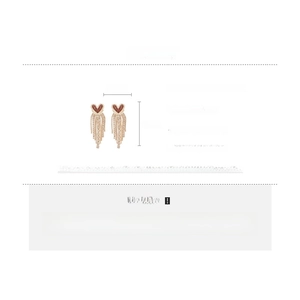 Detailed specs of heart tassel earrings featuring silver needles and red rhinestones