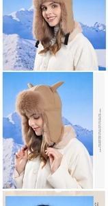 Close-up of winter faux fur trapper hat with cute horn details against snow mountains