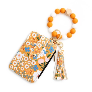 Yellow floral leather wallet with matching fringe tassel and beaded wristlet keychain