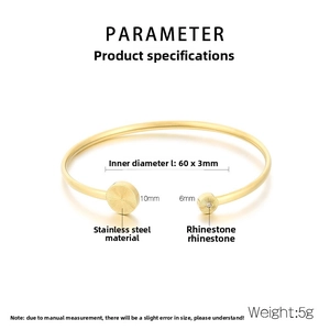 Detailed view of gold stainless steel open bangle with crystal accents and dimensions