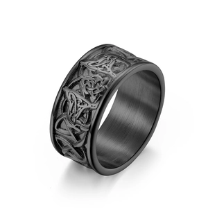 Men's black titanium steel ring featuring Celtic knot relief with a matte brushed inner finish