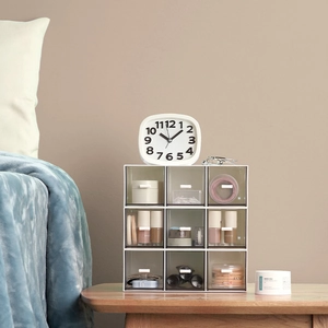 White 9-drawer desktop organizer with transparent plastic drawers for makeup and jewelry