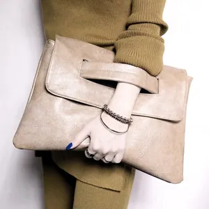 Large elephant gray PU leather clutch bag with cutout handle and minimalist foldover flap