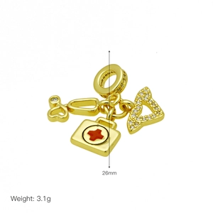 Medical charm detail featuring a 26mm gold stethoscope and red cross medical kit