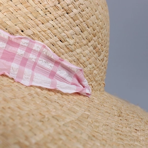 Summer raffia straw sun hat for women featuring pink checkered ribbon and large brim
